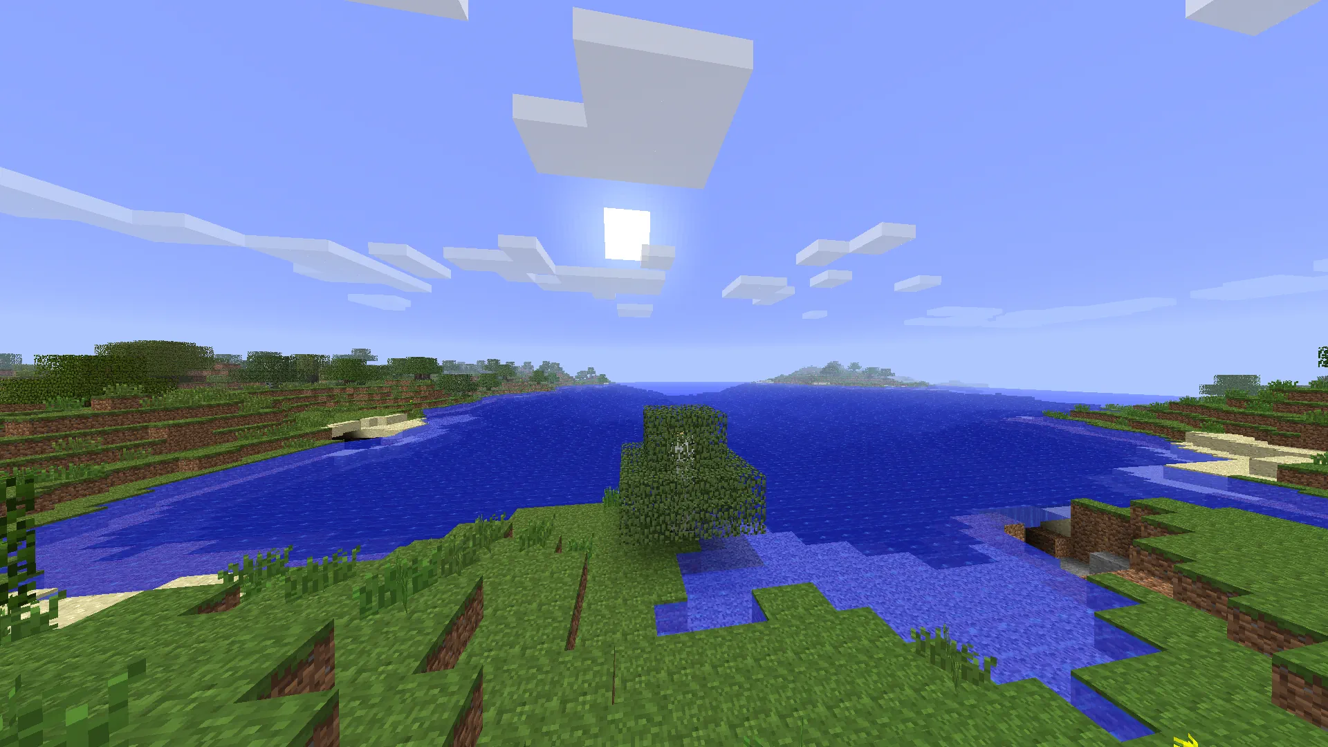 Minecraft landscape with trees, caves, flowers, shrubs and an ocean.